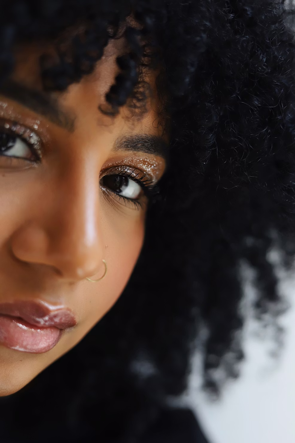 Black woman receiving facial skincare treatment